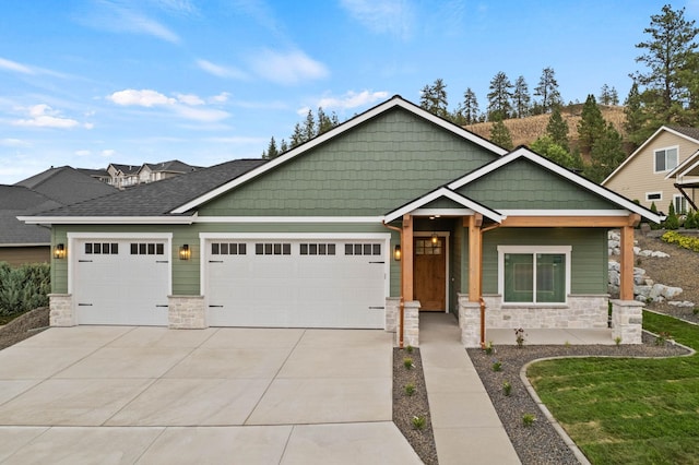 craftsman-style home with a garage