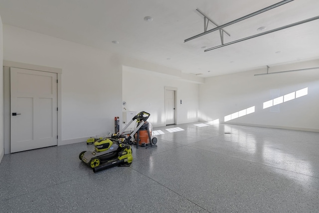 garage featuring baseboards