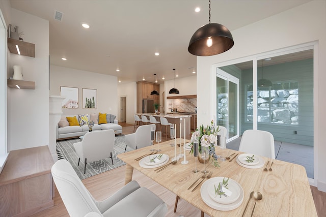 dining area featuring visible vents and recessed lighting