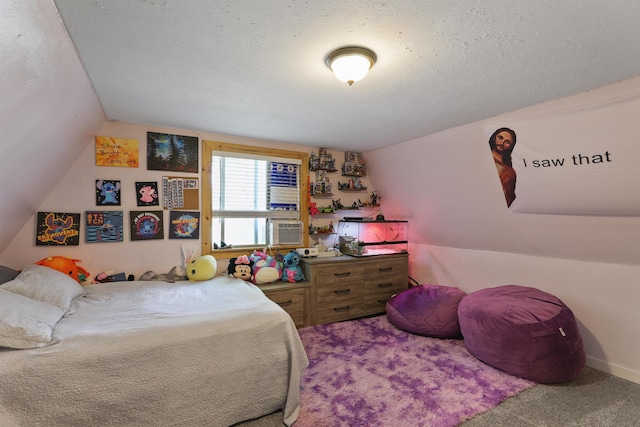 bedroom featuring carpet flooring, a textured ceiling, and vaulted ceiling