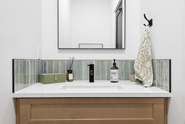 bathroom with decorative backsplash and vanity