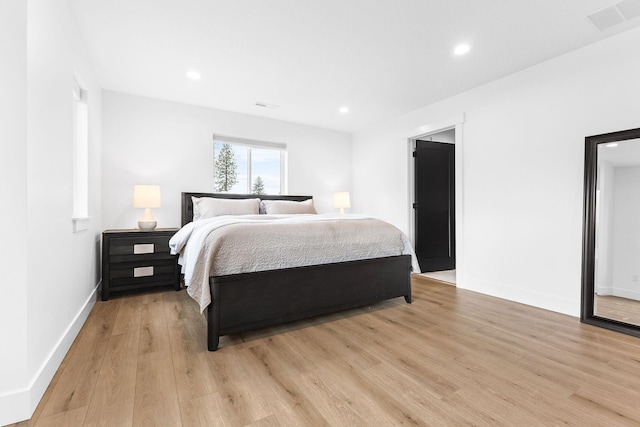 bedroom with light wood-type flooring