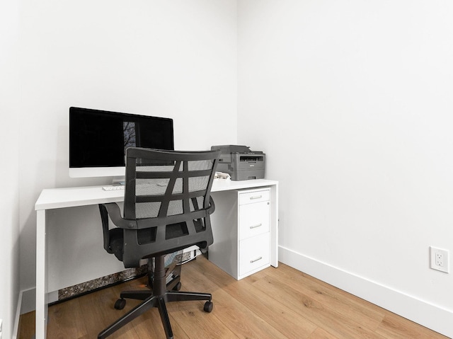 office space with light hardwood / wood-style floors