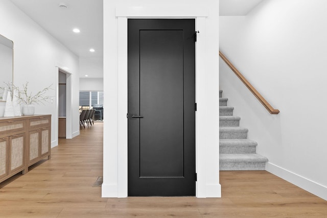 stairway featuring hardwood / wood-style flooring