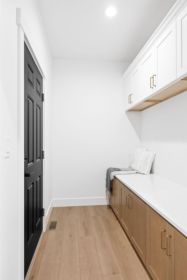 mudroom with light wood-type flooring