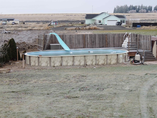 view of pool featuring a water slide