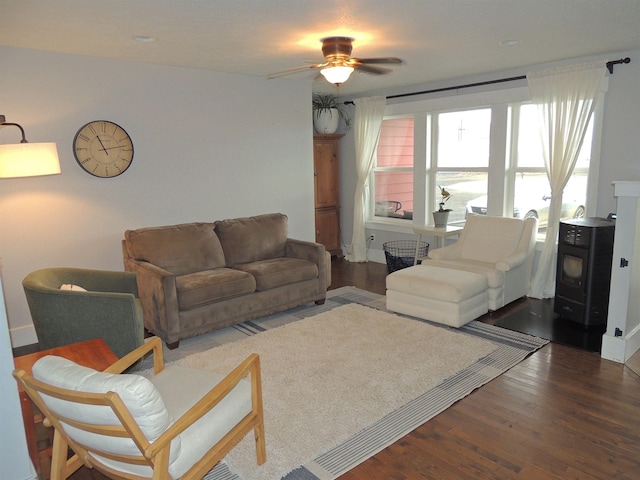 living room with wood-type flooring and ceiling fan