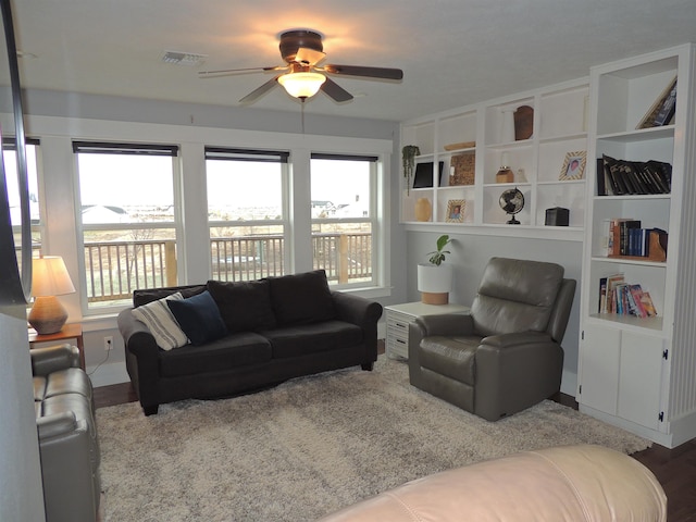 living room with hardwood / wood-style floors and ceiling fan