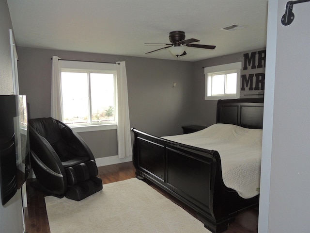 bedroom featuring hardwood / wood-style flooring and ceiling fan