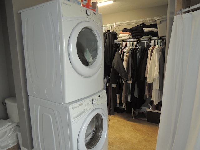 laundry room featuring stacked washer / dryer