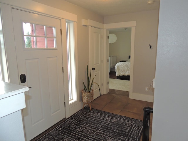 tiled entrance foyer with radiator heating unit