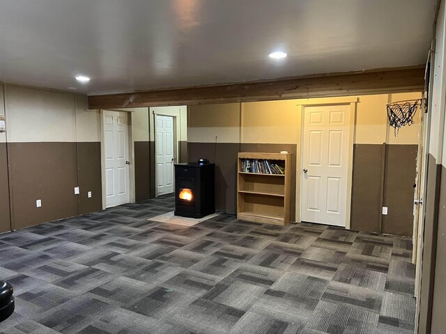 bedroom featuring multiple windows, wooden walls, and dark hardwood / wood-style flooring