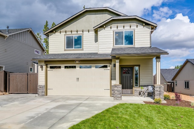 craftsman inspired home featuring a front yard and a garage