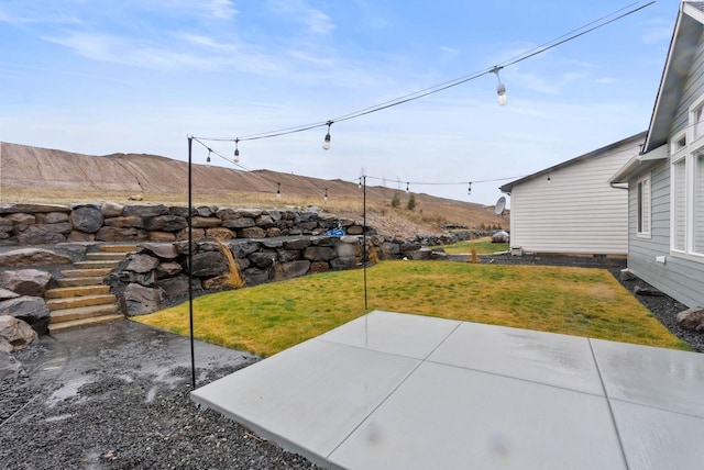 exterior space featuring a patio area and a mountain view