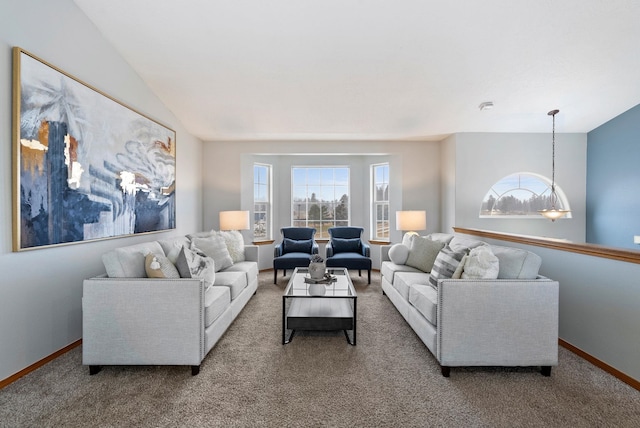 living room with carpet and a chandelier