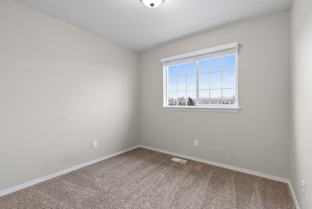 spare room with carpet floors