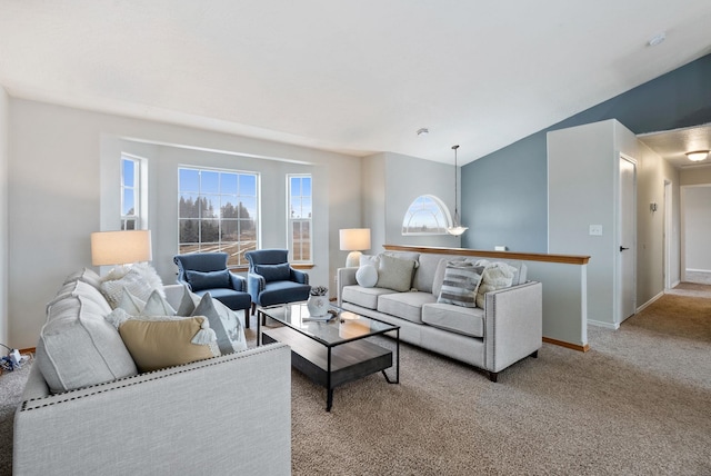 carpeted living room featuring lofted ceiling