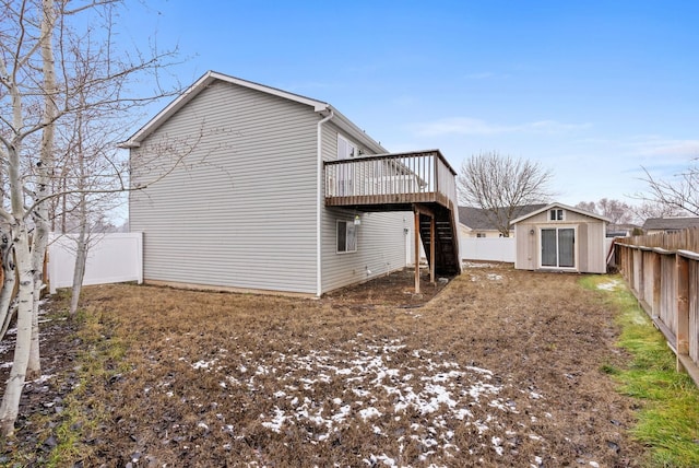 view of home's exterior featuring a shed and a wooden deck