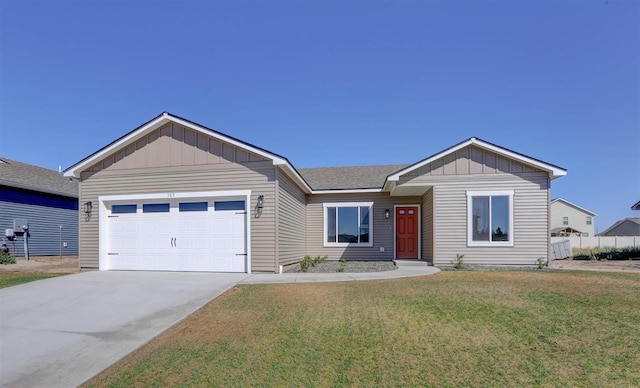 view of front of house with a garage and a front yard