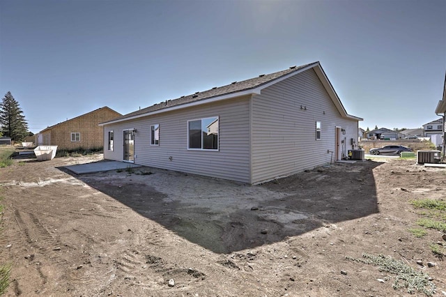 back of property featuring a patio and central AC unit