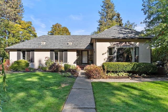 view of front of home with a front lawn