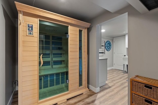 view of sauna featuring hardwood / wood-style flooring