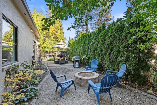 view of patio featuring a fire pit