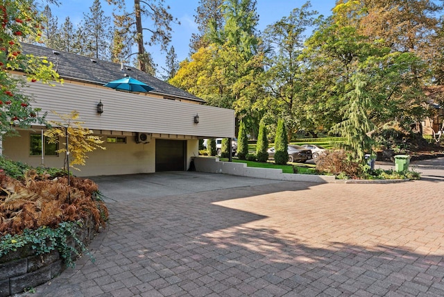 view of property exterior with a garage