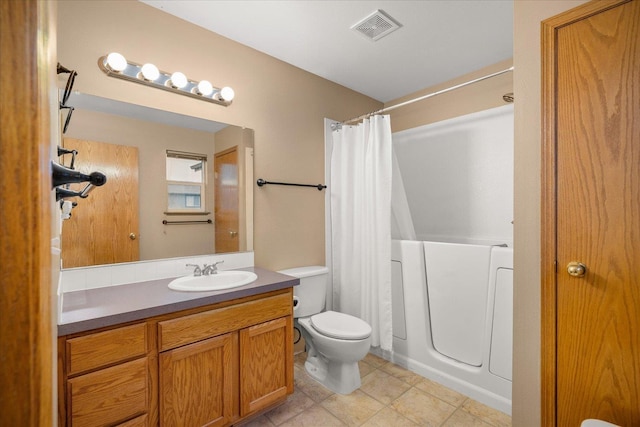 full bathroom featuring vanity, toilet, and shower / bath combo with shower curtain