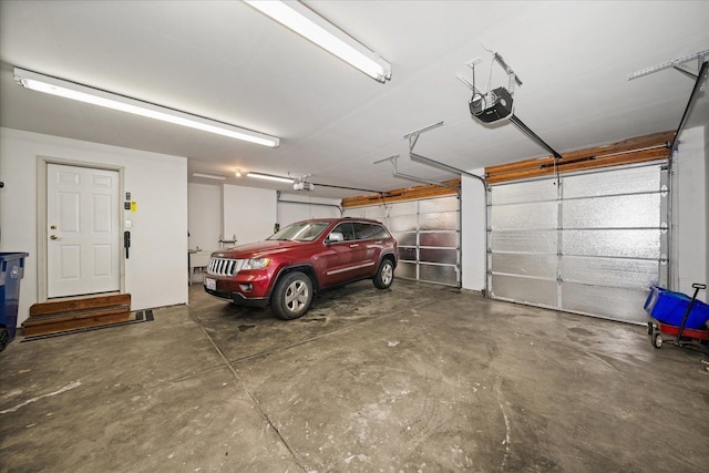 garage featuring a garage door opener