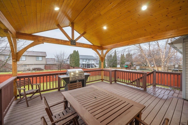 wooden terrace featuring a grill