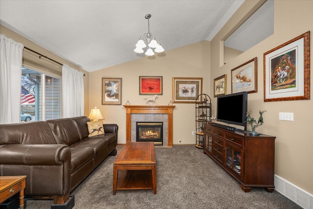 carpeted living room with a notable chandelier, a fireplace, and vaulted ceiling