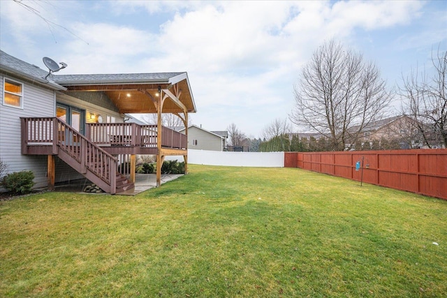 view of yard featuring a wooden deck