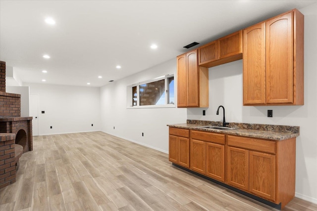 kitchen with sink and light wood-type flooring