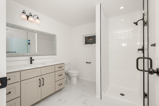 bathroom featuring vanity, an enclosed shower, and toilet