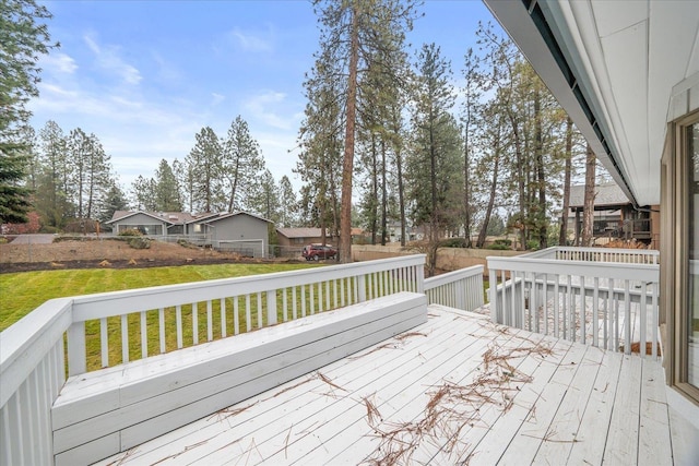 wooden terrace with a lawn