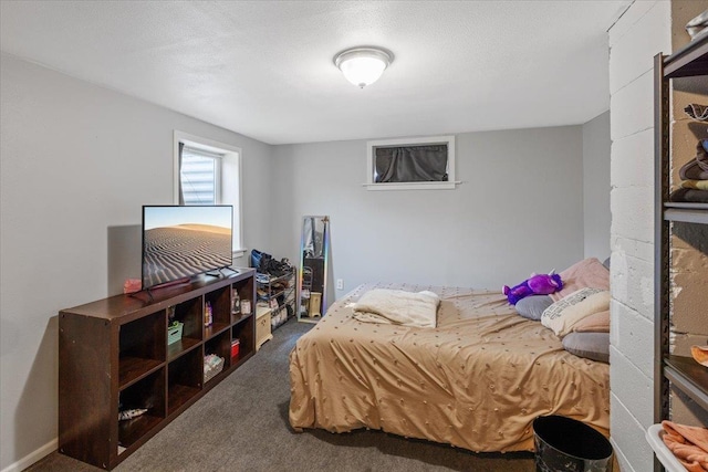 carpeted bedroom with a textured ceiling