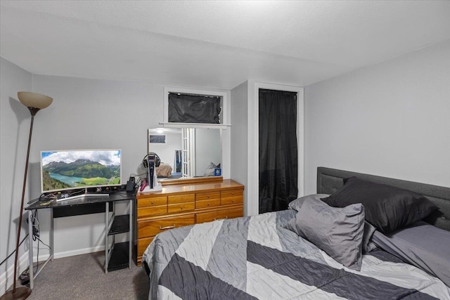 carpeted bedroom with a textured ceiling