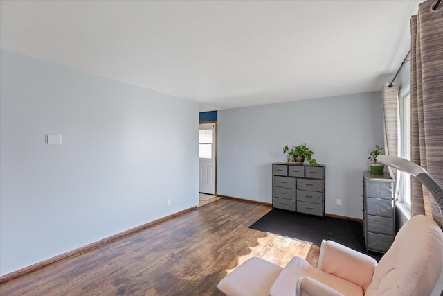 unfurnished living room featuring dark hardwood / wood-style flooring