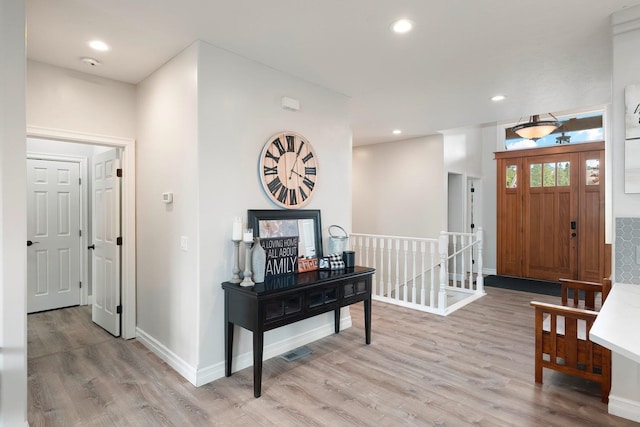 foyer entrance featuring light hardwood / wood-style flooring