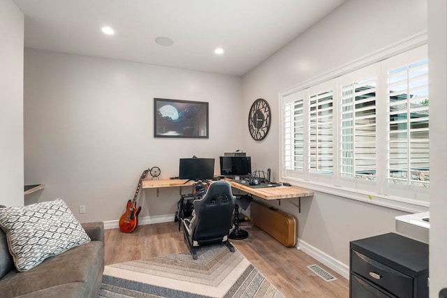 office area featuring light wood-type flooring and a wealth of natural light