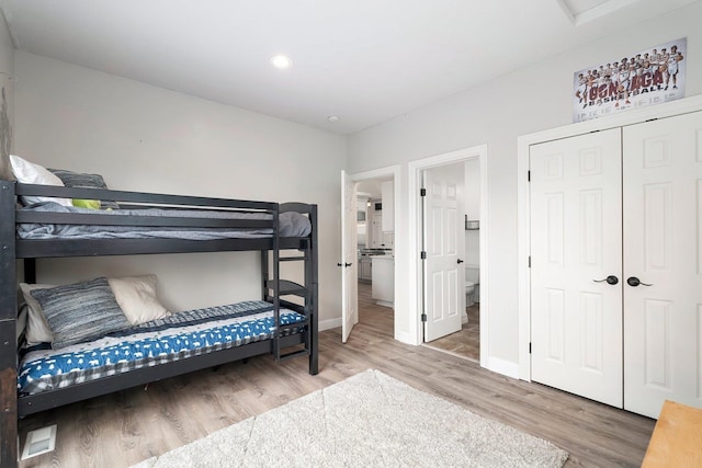 bedroom featuring hardwood / wood-style flooring and a closet