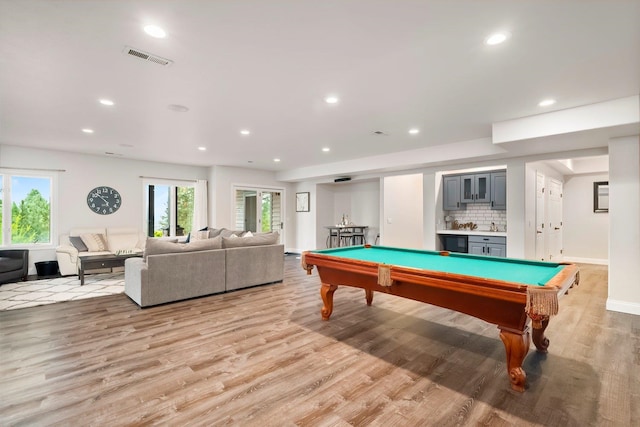 game room with billiards and light hardwood / wood-style flooring