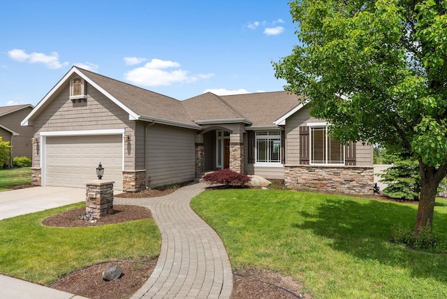 craftsman-style home with a garage and a front yard