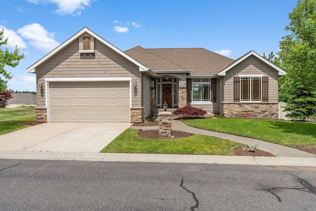 craftsman-style home with a garage and a front yard