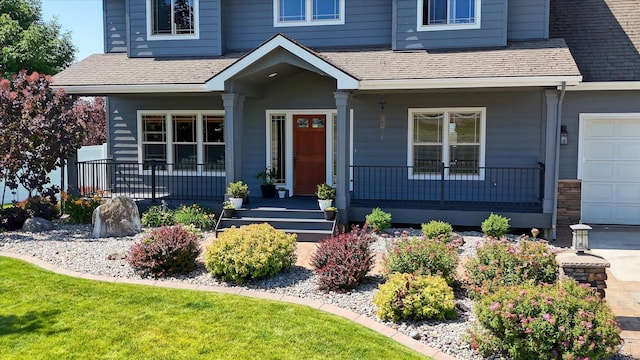 view of front of house featuring a garage and covered porch