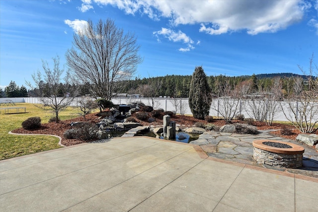 view of patio / terrace with a fire pit