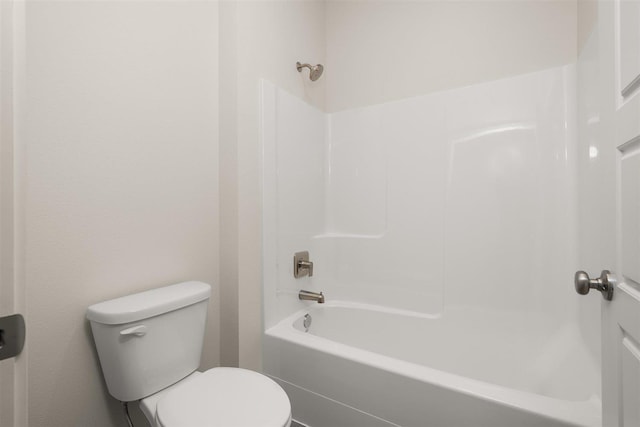 bathroom with shower / bathtub combination and toilet