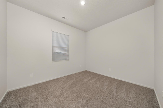 empty room featuring carpet floors