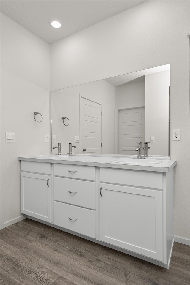 bathroom featuring hardwood / wood-style floors and vanity